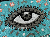 Handcrafted Evil Eye Jute Clutch