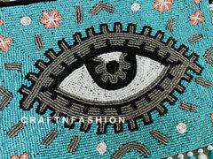 Handcrafted Evil Eye Jute Clutch